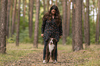 woman and Miniature Australian Shepherd