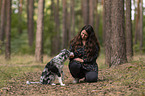 woman and Miniature Australian Shepherd