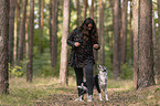 woman and Miniature Australian Shepherd