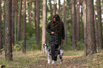woman and Miniature Australian Shepherd