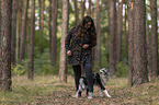 woman and Miniature Australian Shepherd