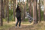 woman and Miniature Australian Shepherd