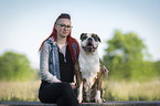 woman and sitting Olde English Bulldog