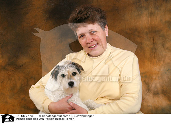 woman snuggles with Parson Russell Terrier / SS-26739