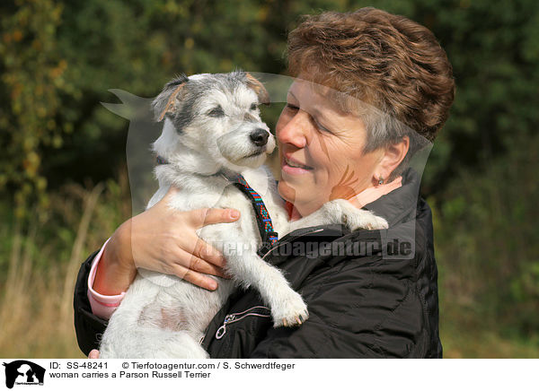woman carries a Parson Russell Terrier / SS-48241