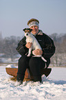 woman and Parson Russell Terrier in the snow