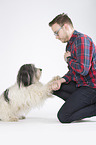man and Polish Lowland Sheepdog