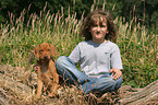 boy with Rhodesian Ridgeback puppy