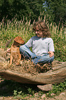 boy with Rhodesian Ridgeback puppy
