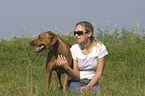 young woman with Rhodesian Ridgeback