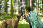 woman with Rhodesian Ridgeback