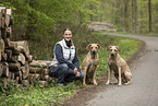 woman and 2 Rhodesian Ridgebacks