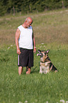man and German Shepherd