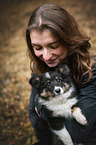 woman and Sheltie puppy