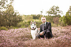 man and Siberian Husky