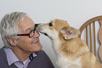 man and Welsh Corgi Pembroke