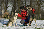 man with huskies