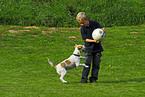 boy playing with dog