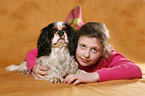 girl with King Charles Spaniel