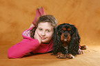 girl with King Charles Spaniel