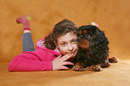 girl with King Charles Spaniel