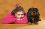 girl with King Charles Spaniel
