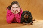 girl with King Charles Spaniel
