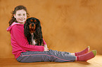 girl with King Charles Spaniel