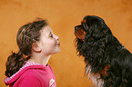 girl with King Charles Spaniel