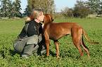 woman with Rhodesian Ridgeback