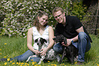 man and woman with dogs