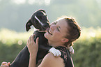 woman and young mongrel