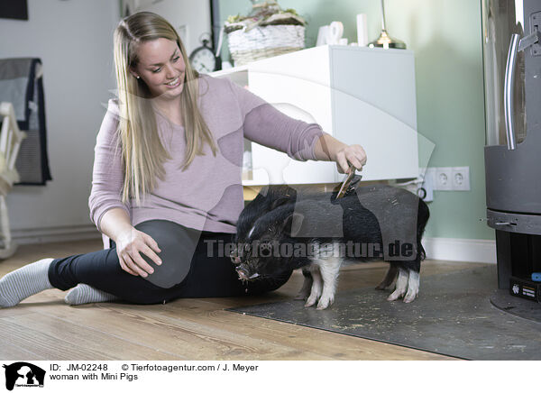 woman with Mini Pigs / JM-02248