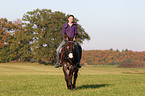 woman rides donkey