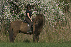 woman rides pony