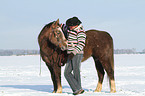 man and American Paint Horse