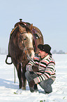 man and American Paint Horse