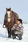 man and American Paint Horse