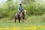 man rides American Paint Horse
