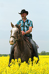 man rides American Paint Horse