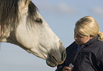 woman and Andalusian horse