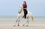 woman rides Andalusian Horse