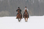 2 riders with horse