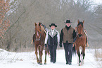 man and woman with horses