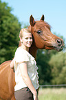 woman and arabian horse