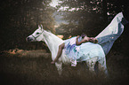 woman and arabian horse