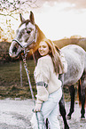 woman and arabian horse