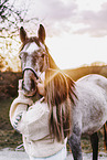 woman and arabian horse