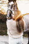 woman and arabian horse