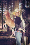 woman and 2 horses